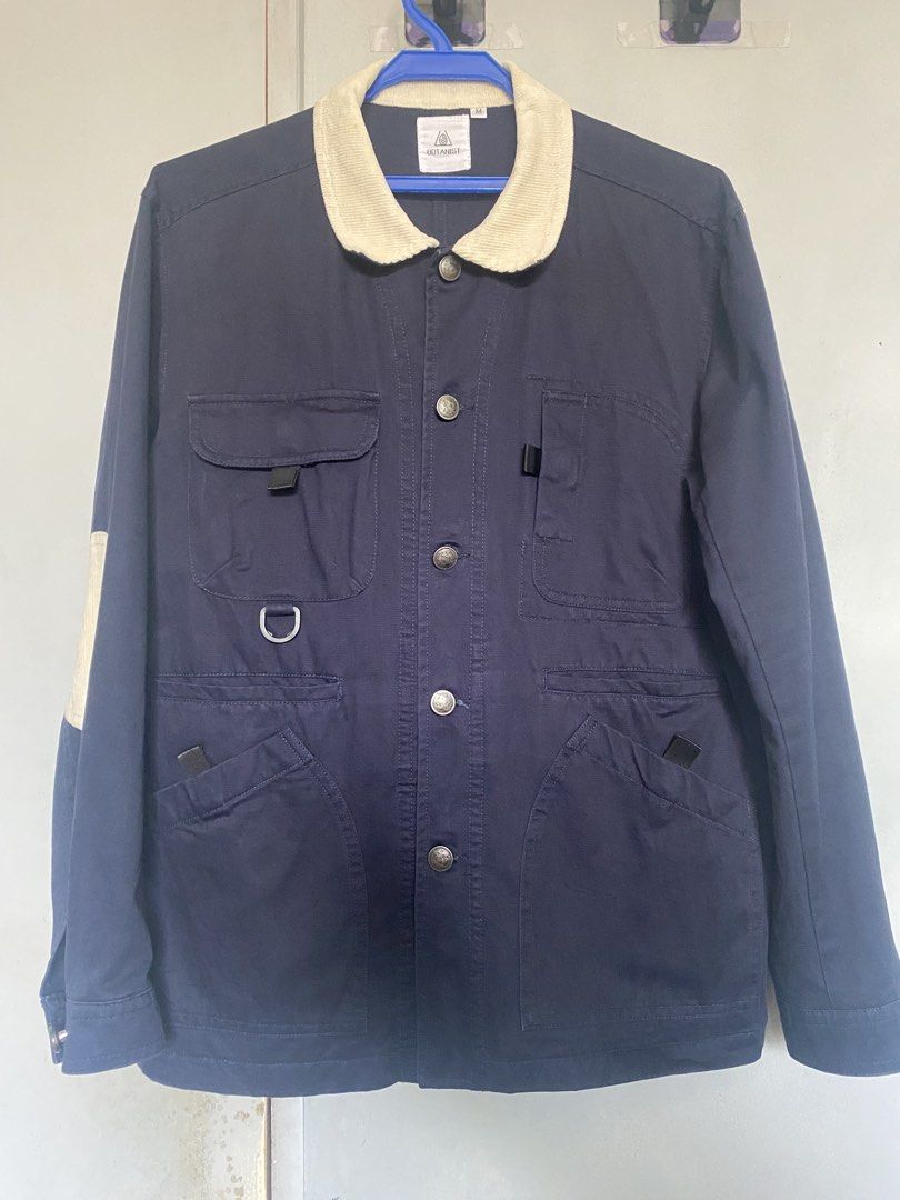 Botanist Navy Chore Jacket (Category: Coats, Jackets and Outerwear) located in Manila. Submitted by antonvarga38504 (Listing ID 1468983473, Image 1). Description: - Brand: Botanist - Color: Navy Blue - Size: Medium - Design details: Contrasting white corduroy collar and round elbow patches on both sleeves - Closure: Button-up front with metallic buttons - Pockets & Features: Multiple utility pockets on the chest and lower front, plus a functional