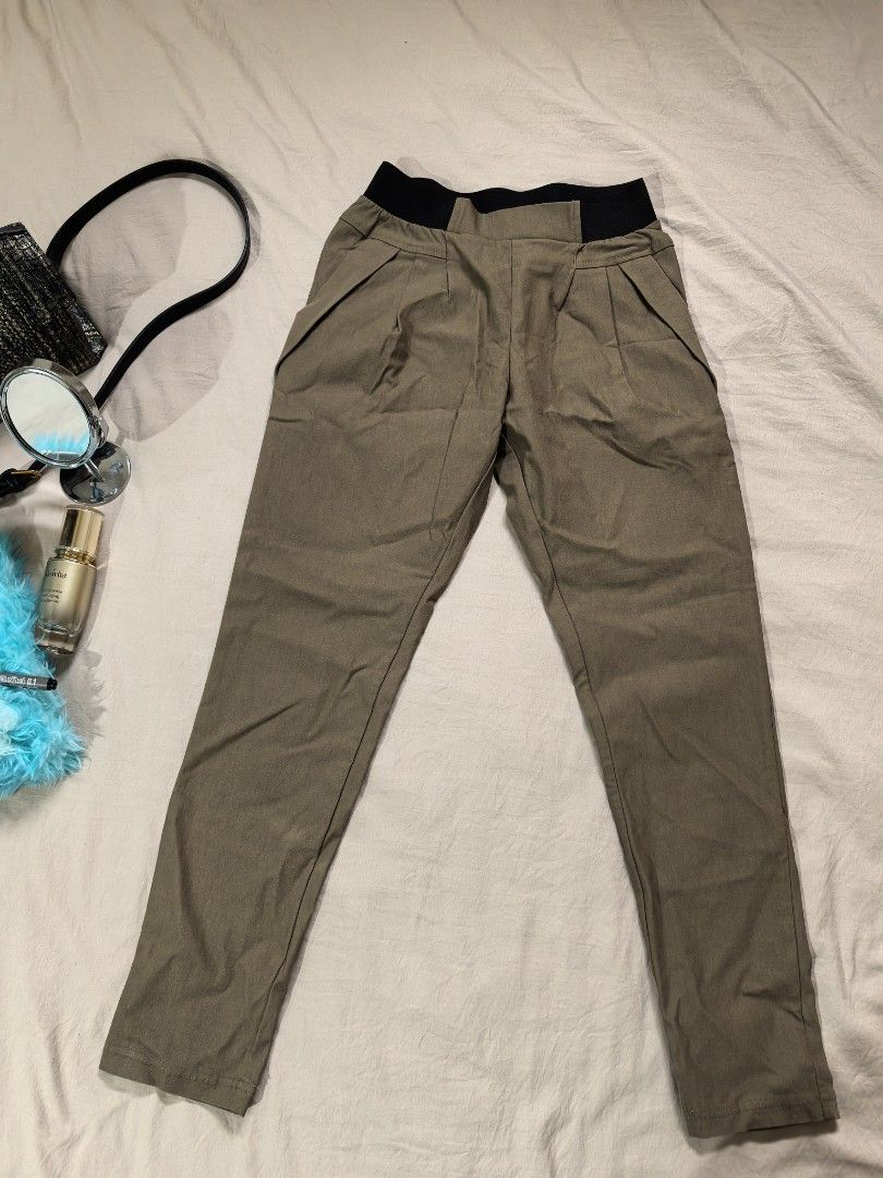Bou Jeloud BASIC Pleated Casual Pants Size 36 (Category: Trousers) located in Tacloban City. Submitted by thead.declutters (Listing ID 1469084557, Image 1). Description: - Brand/Model: Bou Jeloud BASIC casual pants - Color: Khaki - Size: 36 - Material: Rayon, nylon, and polyurethane blend - Features: Elastic black waistband, front pleats, and side pockets - Condition: Clean tag intact, well-maintained with a soft texture - Styling: Easy to match 