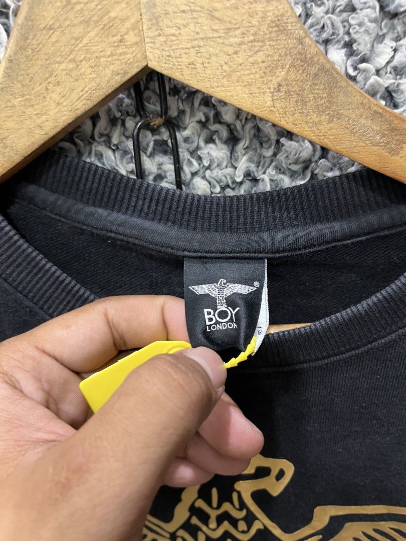 BOY London featuring a metallic gold eagle graphic | Size M (Category: Tshirts & Polo Shirts ) located in General Trias. Submitted by zrchustle.604 (Listing ID 1469076373, Image 3). Description: BOY London featuring a metallic gold eagle graphic and the word "BOY" across the chest, along with zipper details at the bottom hem..