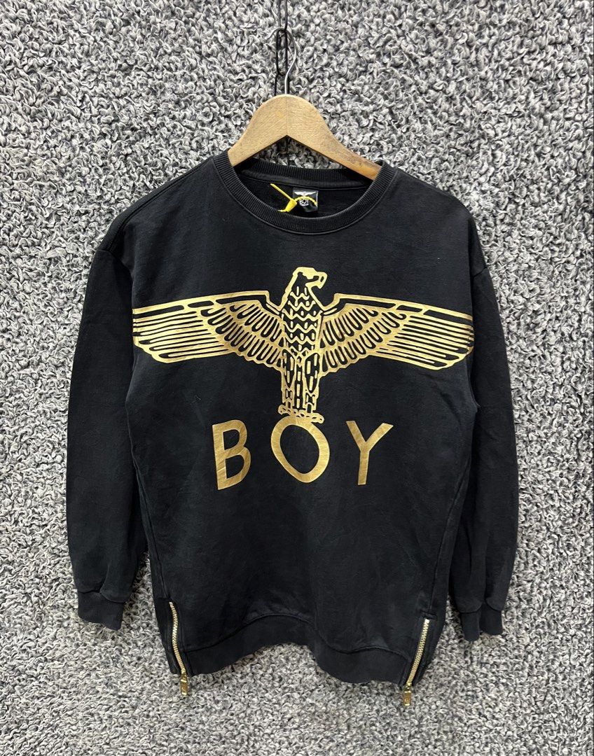 BOY London featuring a metallic gold eagle graphic | Size M (Category: Tshirts & Polo Shirts ) located in General Trias. Submitted by zrchustle.604 (Listing ID 1469076373, Image 1). Description: BOY London featuring a metallic gold eagle graphic and the word "BOY" across the chest, along with zipper details at the bottom hem..