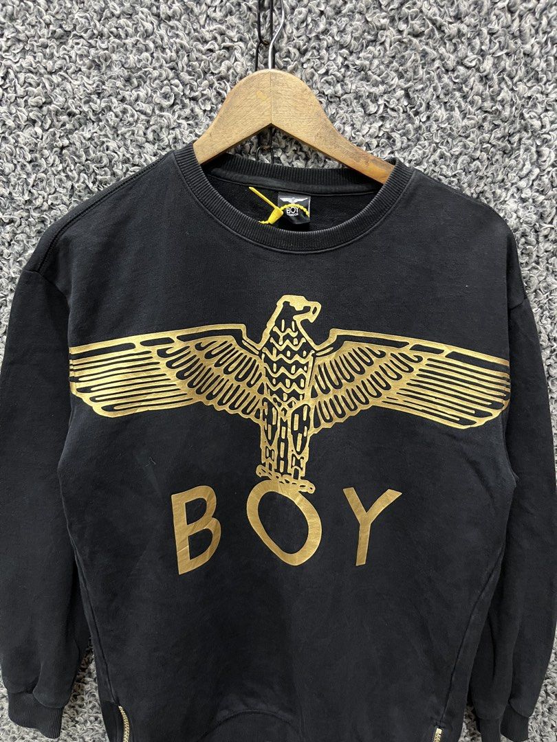 BOY London featuring a metallic gold eagle graphic | Size M (Category: Tshirts & Polo Shirts ) located in General Trias. Submitted by zrchustle.604 (Listing ID 1469076373, Image 2). Description: BOY London featuring a metallic gold eagle graphic and the word "BOY" across the chest, along with zipper details at the bottom hem..