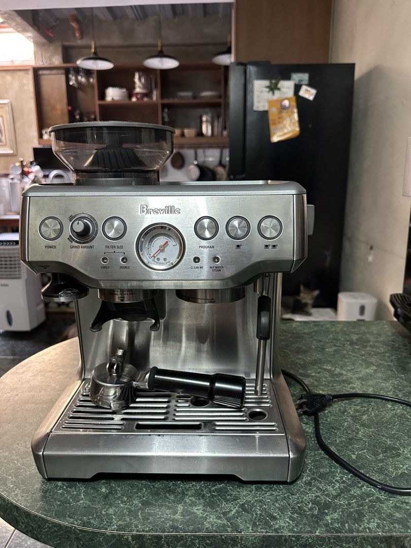 Breville Barista Express Espresso Machine with Grinder (Category: Coffee Machines & Makers) located in Manila. Submitted by olxph_561736521 (Listing ID 1468949038, Image 1). Description: - Model: Breville espresso machine in brushed stainless steel finish - Grinder: Built-in conical burr grinder with side adjustable grind size dial - Controls: Centered pressure gauge with buttons for single/double shots, program settings, and manual control - Inc