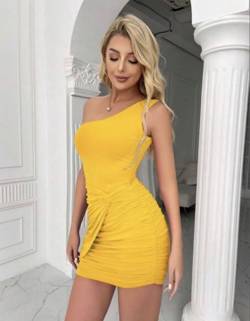 Bright Yellow One-Shoulder Ruched Mini Dress (Category: Dresses) located in Marikina City. Submitted by jessylady10 (Listing ID 1468979653, Image 3). Description: - Color: Bright yellow - Fit: Bodycon mini - Neckline: One-shoulder - Details: Ruching on sides with front wrap twist at the hip - Fabric: Stretchy and figure-hugging - Occasion: Perfect for nights out, parties, and clubbing.