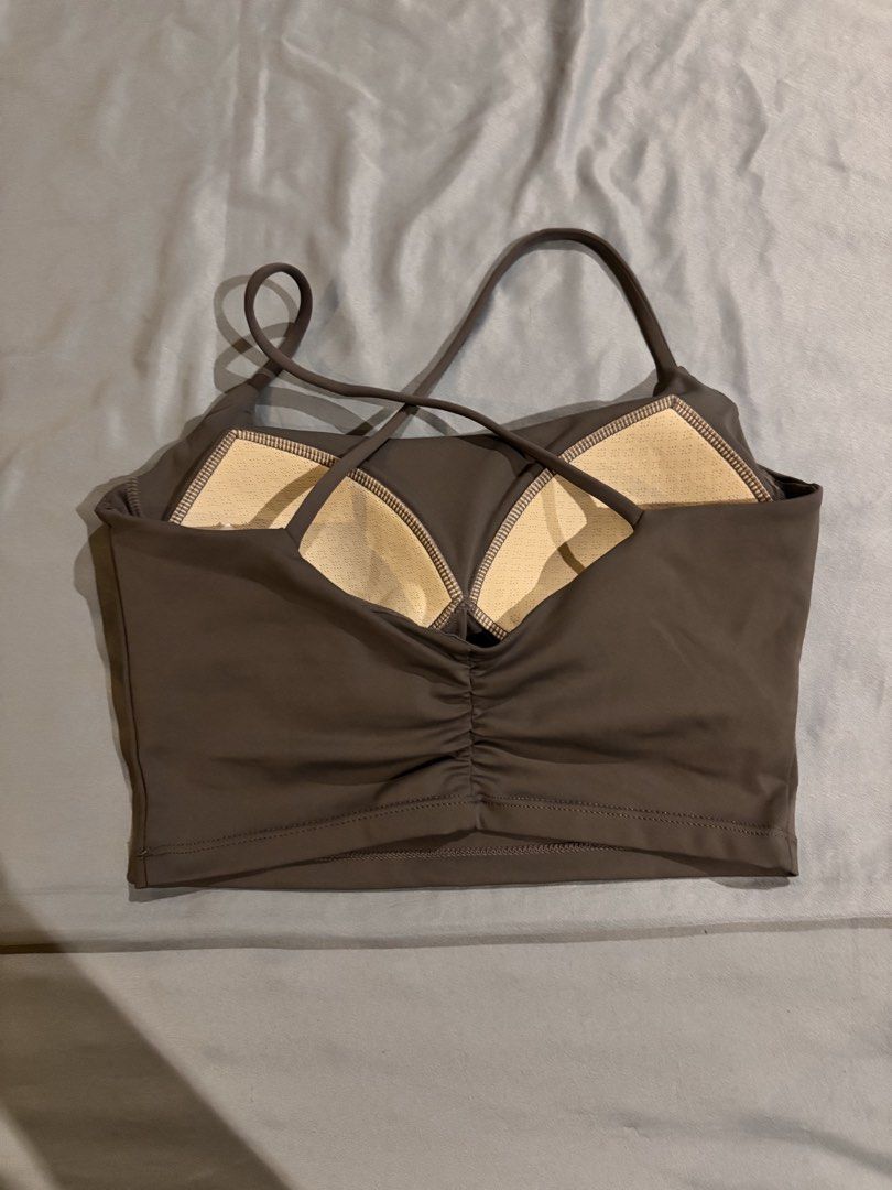 Brown Active Crop Top with Criss-Cross Straps (Category: Sleeveless) located in Manila. Submitted by keiii00028 (Listing ID 1468966405, Image 2). Description: - Color: Brown - Style: Active crop top with trendy criss-cross back straps and cute ruched back detail - Support: Built-in bra with removable pads included - Material: Stretchy, comfortable fabric ideal for workouts and yoga - Versatility: Easy to pair with high-waisted leggings or shorts.