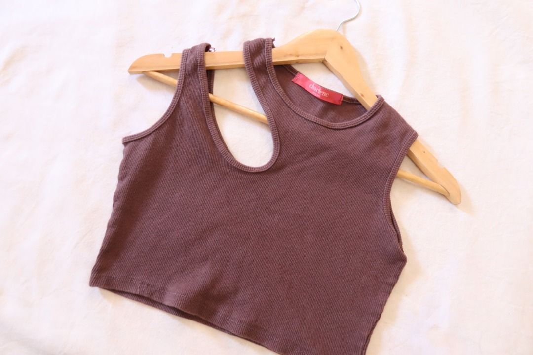 Brown asymmetrical crop top tank top (Category: Sleeveless) located in Manila. Submitted by imama23 (Listing ID 1468949875, Image 2). Description: - Color: Brown - Material: Stretchy ribbed knit - Design: Sleeveless crop top with a trendy asymmetrical cutout neck strap Condition: 8/10, has minor loose stitches Size: Fits S Location: Manila (near taft) Shipping - Payment first before shipping - J&T, Grab, or Lalamove (buyer may choose preferred co