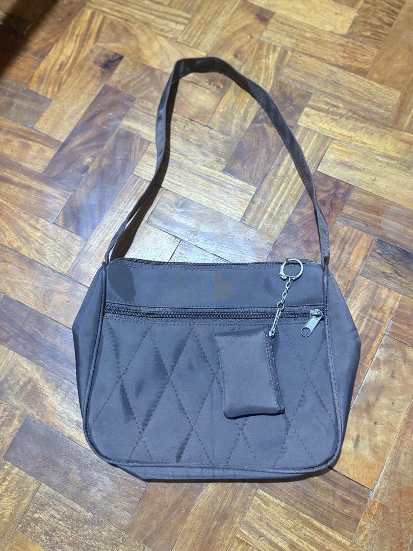 Brown Quilted Nylon Shoulder Bag with Coin Pouch (Category: Shoulder Bags) located in Manila. Submitted by only_alyssacloset (Listing ID 1469011133, Image 2). Description: - Stylish brown quilted nylon shoulder bag for everyday use. - Secure zip top closure with a convenient front zip pocket. .
