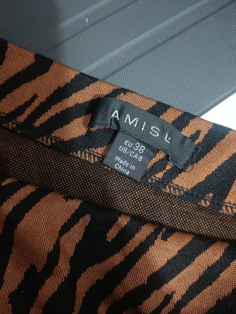 Brown/Black Tiger Zebra Print (Category: Skirts) located in Manila. Submitted by byjrb (Listing ID 1469063266, Image 2). Description: 🛍️ Brand-new items from SHEIN, Emery Rose, Zaful, No brand & more! Size : Small to Medium, cotton stretch ganda ng fabric 📦 Shipping: LBC / J&T / Lalamove 💸 MOP: GCash / BPI only Note : Brand is listed as SHEIN for listing purposes. All items are sourced from shein-bales. Shipping schedule. Wednesday and Saturda