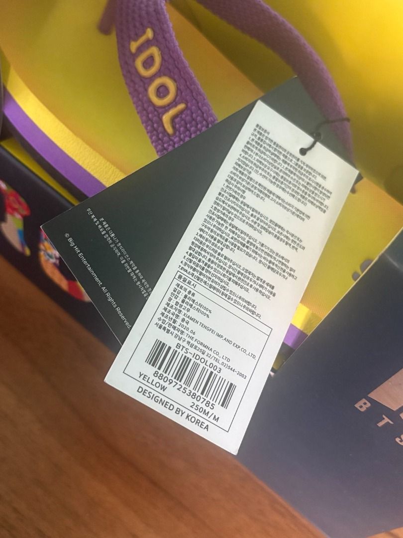 BTS IDOL Slippers (Category: K-Wave Merchandise) located in Baguio. Submitted by shine.dream.smile (Listing ID 1469039657, Image 2). Description: Condition - Unopened (no seal when it arrived but was never opened by the seller) - Damages/imperfections: Original box is slightly damaged (dents and scratches). Stains on plastic logo. Details - Inclusions: Actual product and seller’s packaging - Size: KR 250 - Rarity: Uncommon - Availability: On hand