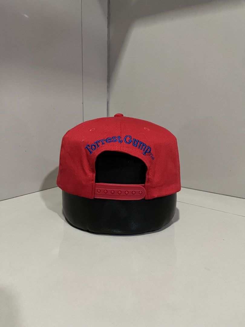 Bubba Gump Shrimp Co. Forrest Gump Snapback Cap (Category: Caps & Hats) located in Maasin. Submitted by niconii090 (Listing ID 1468984772, Image 3). Description: - Official Bubba Gump Shrimp Co. red snapback cap - Embroidered logo on the front and 'Forrest Gump' text in blue on the back - Classic green under-brim detail - Adjustable red plastic snap closure for a custom fit - 100% cotton material, made in China.