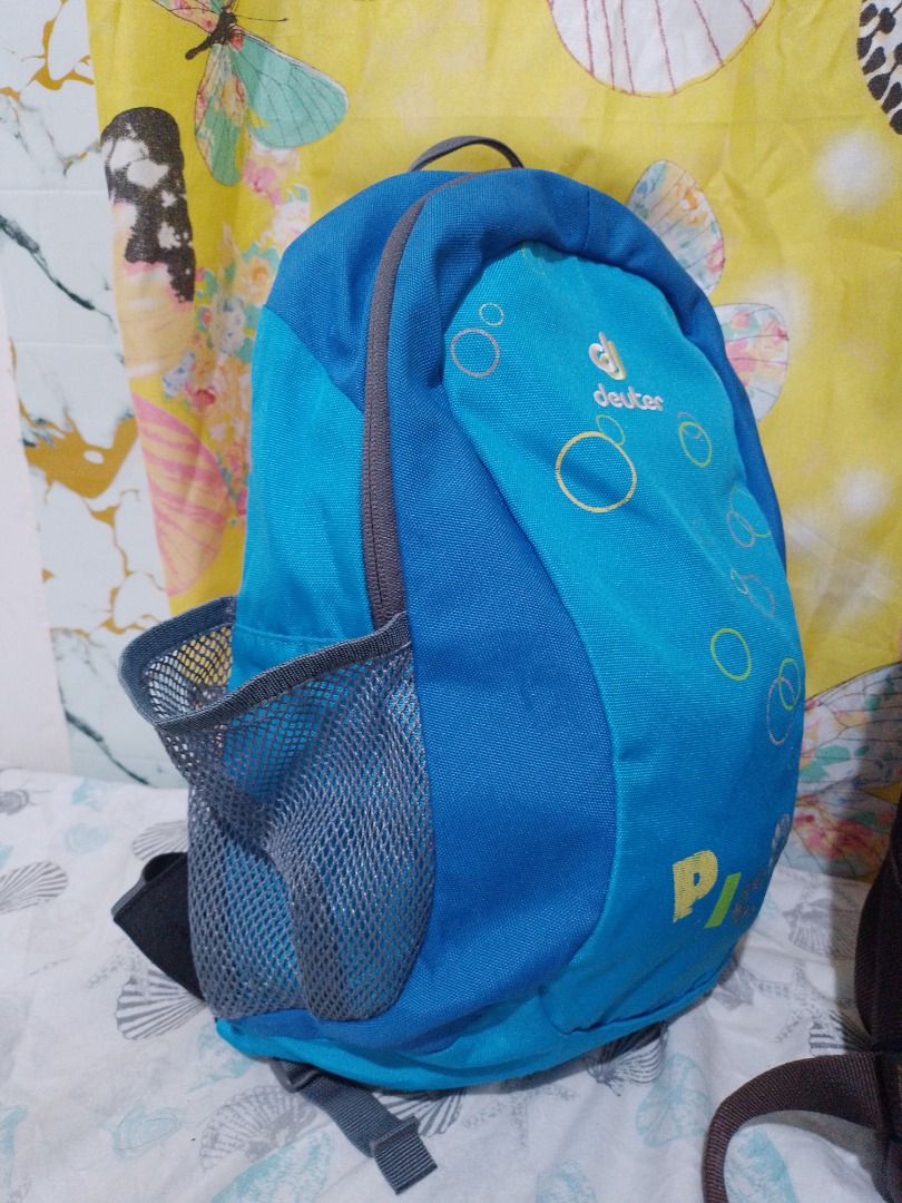 Bundle Deuter and Camji Backpacks (Category: Backpacks) located in Imus. Submitted by bestfinds_yeth0724 (Listing ID 1469113029, Image 2). Description: - 2-in-1 Backpack Bundle: Perfect for school, travel, or casual days out - Bag 1: Blue Deuter Pico kids backpack featuring fun bubble graphics and convenient mesh side pockets - Bag 2: Camji Brown and orange backpack equipped with comfortable padded mesh shoulder straps and handy front zippered co