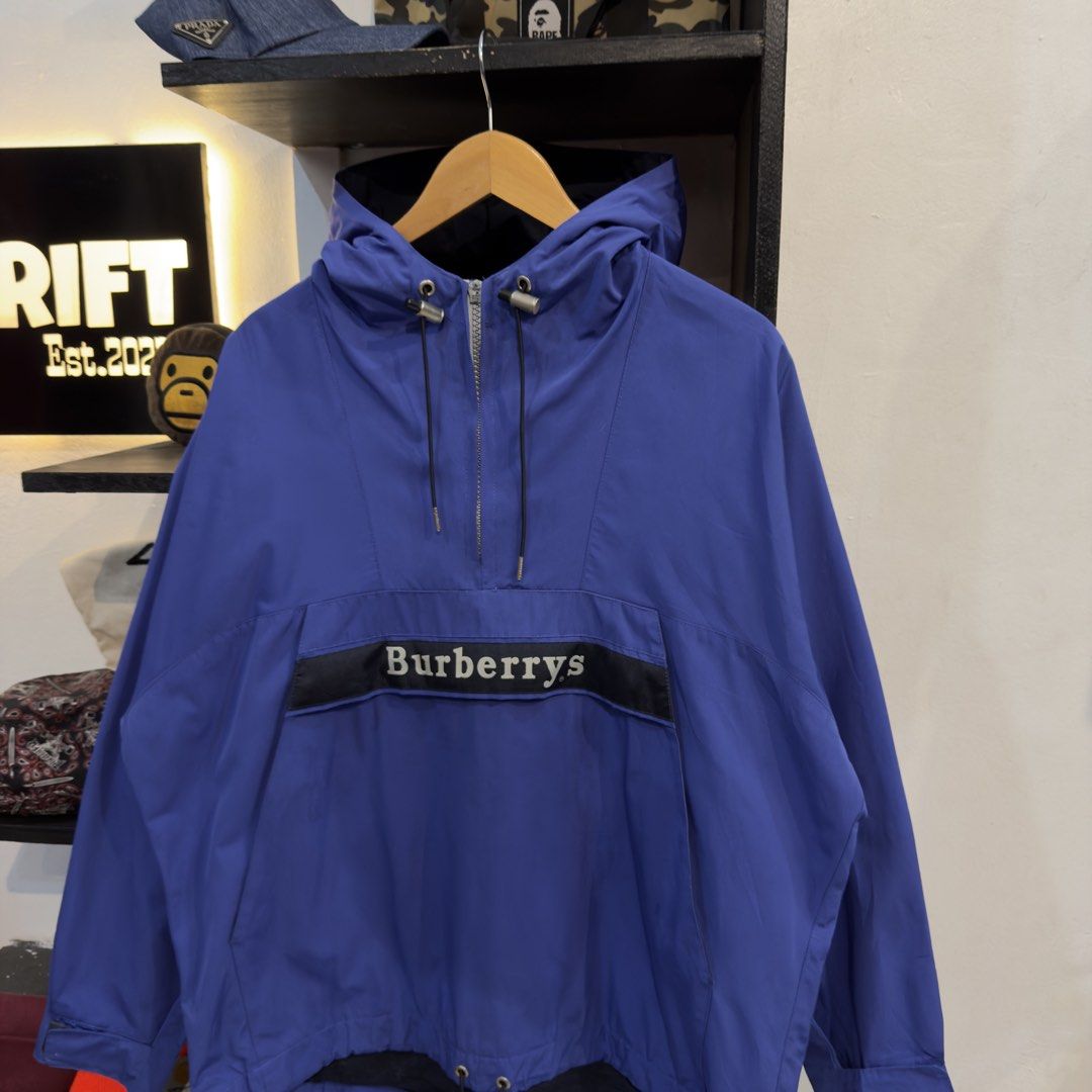 Burberry Blue Anorak Windbreaker (Category: Coats, Jackets and Outerwear) located in Manila. Submitted by jerichomal82553 (Listing ID 1469046629, Image 2). Description: Burberry Blue Anorak Windbreaker 26 by 27 Good Condition Complete Tags Issu Zipper Puller CLAIM 2k.