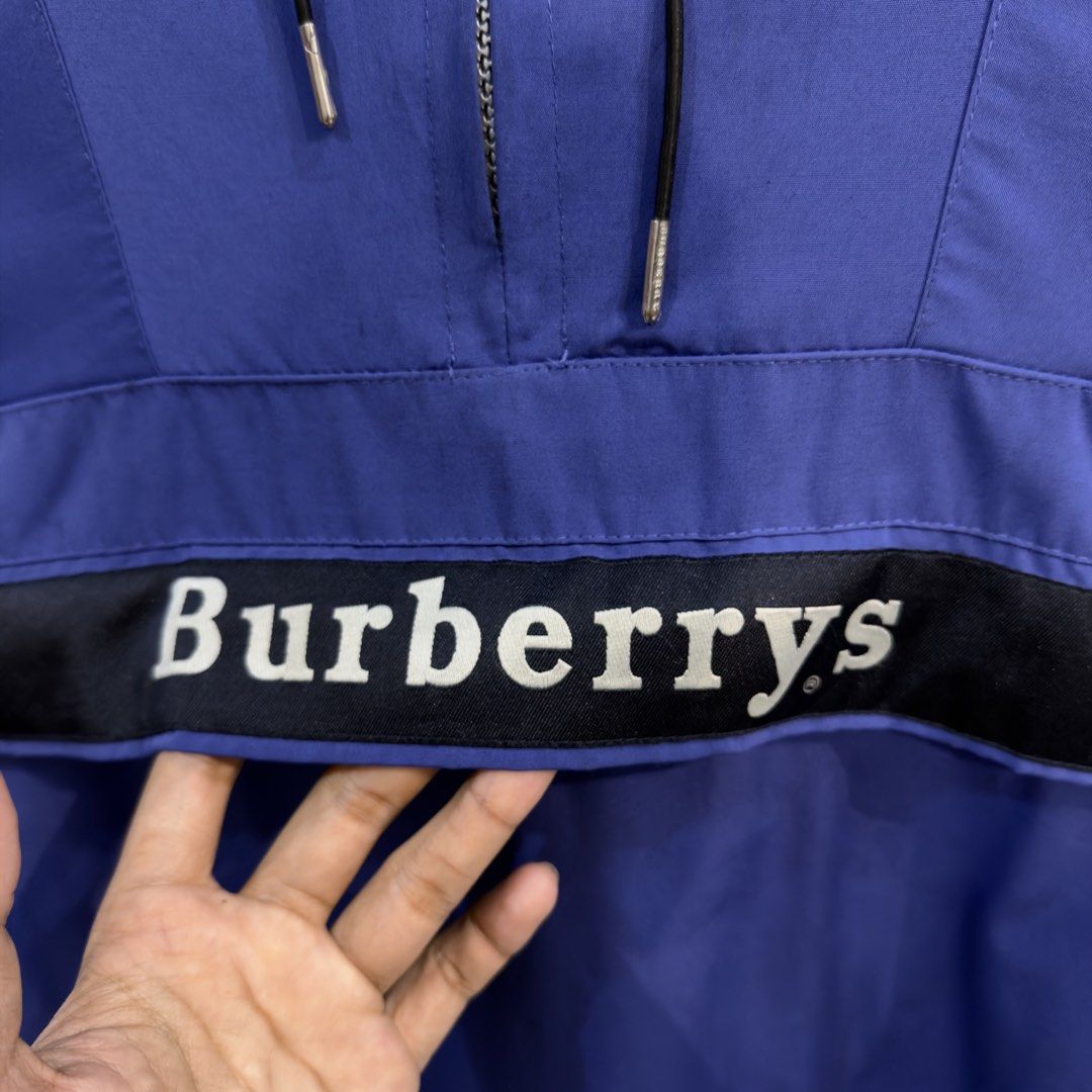 Burberry Blue Anorak Windbreaker (Category: Coats, Jackets and Outerwear) located in Manila. Submitted by jerichomal82553 (Listing ID 1469046629, Image 3). Description: Burberry Blue Anorak Windbreaker 26 by 27 Good Condition Complete Tags Issu Zipper Puller CLAIM 2k.