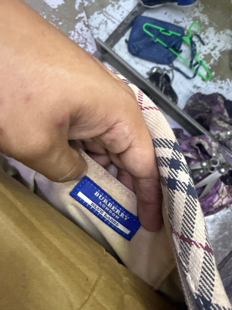 Burberry Blue Label Nova Check Handbag (Category: Luxury Bags & Wallets) located in Manila. Submitted by happywhale-0f64 (Listing ID 1469003482, Image 2). Description: - Authentic Burberry Blue Label handbag in iconic nova check pattern - Dark brown leather trim and dual top handles - Secure top zip closure with silver-tone branded hardware - Clean canvas body with interior Burberry London Blue Label tag - Compact size, ideal for everyday use.