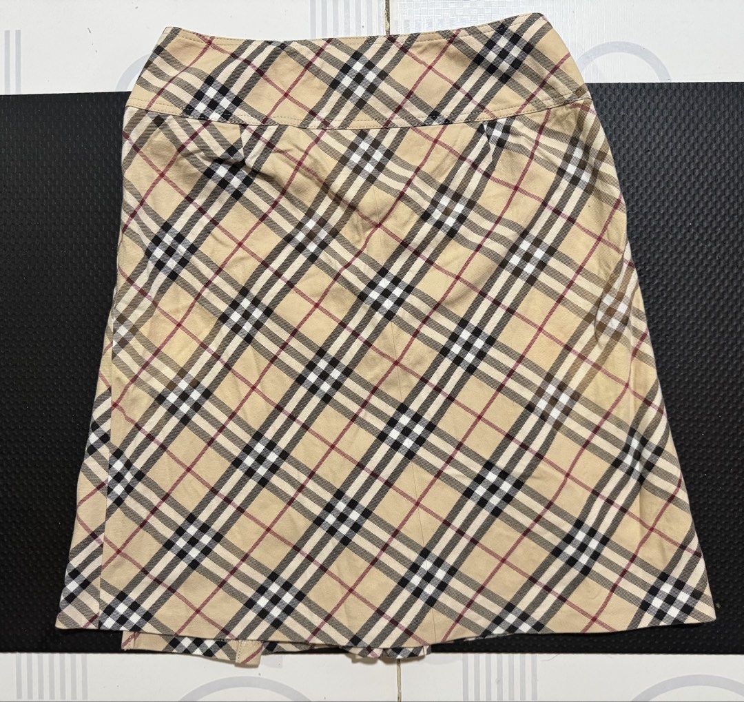 Burberry nova Plaid blue label (Category: Skirts) located in Cebu City. Submitted by etnaner (Listing ID 1468935624, Image 3). Description: Nova Plaid Size: 38 on tag fits 25-26W Issue some faded parts stain on leather buckle Still wearable .