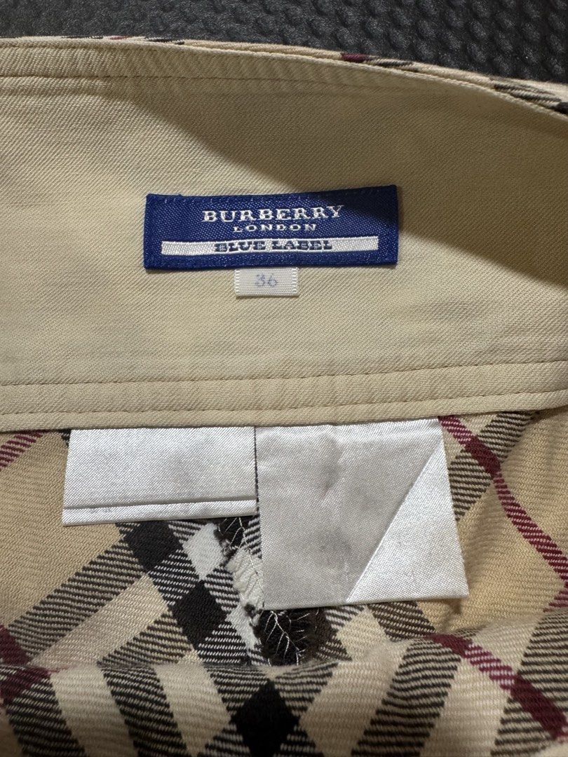 Burberry nova Plaid blue label (Category: Skirts) located in Cebu City. Submitted by etnaner (Listing ID 1468935624, Image 2). Description: Nova Plaid Size: 38 on tag fits 25-26W Issue some faded parts stain on leather buckle Still wearable .