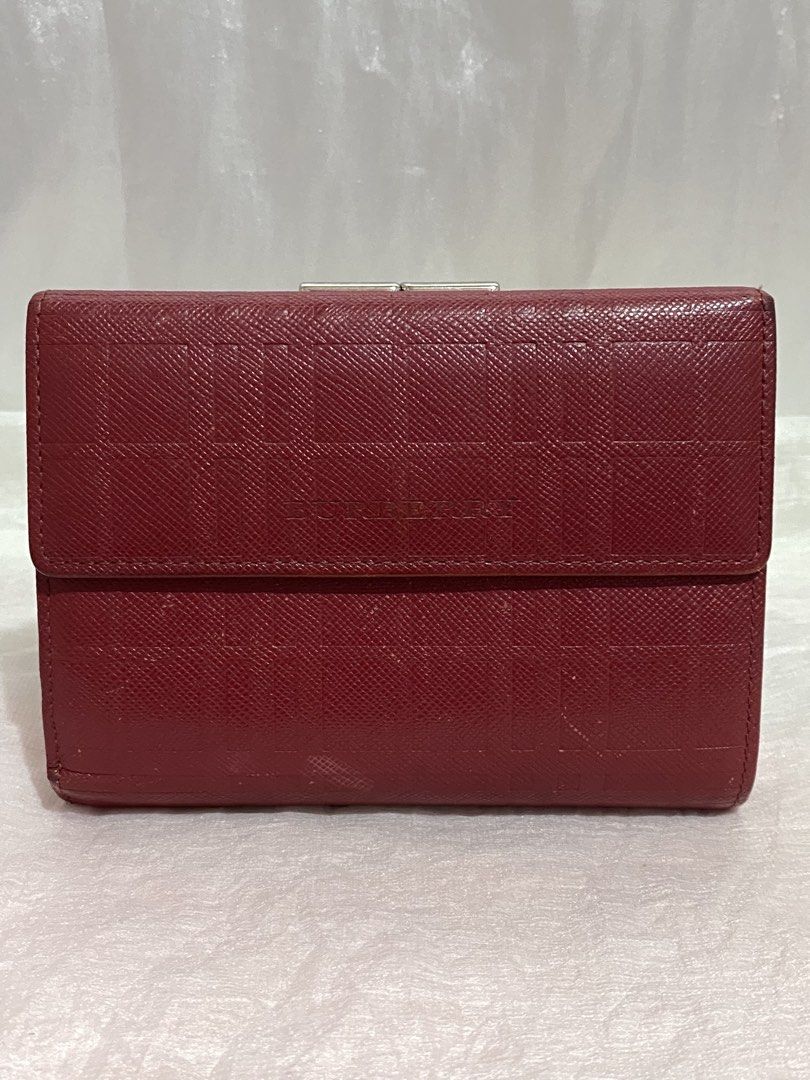 Burberry red wallet bifold (Category: Luxury Bags & Wallets) located in Taguig. Submitted by nekosan_ (Listing ID 1468974228, Image 1). Description: Original nabili ko sa japan Rfs: nag palit na ako wallet masyado malaki for me May pagka cherry red (dark red) sa personal Okay pa leather sign of use lang.