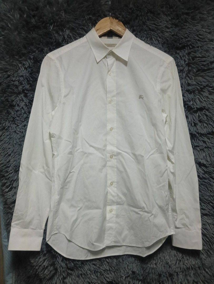 Burberry White Plaid Polo Longsleeve Button Down (Category: Activewear) located in Manila. Submitted by thrift_marvs (Listing ID 1469126347, Image 1). Description: Burberry White Plaid Polo Longsleeve Authentic Size Small Dimension 19.5 Width 28 Length No Issue Need Wash 980 plus shipping fee.