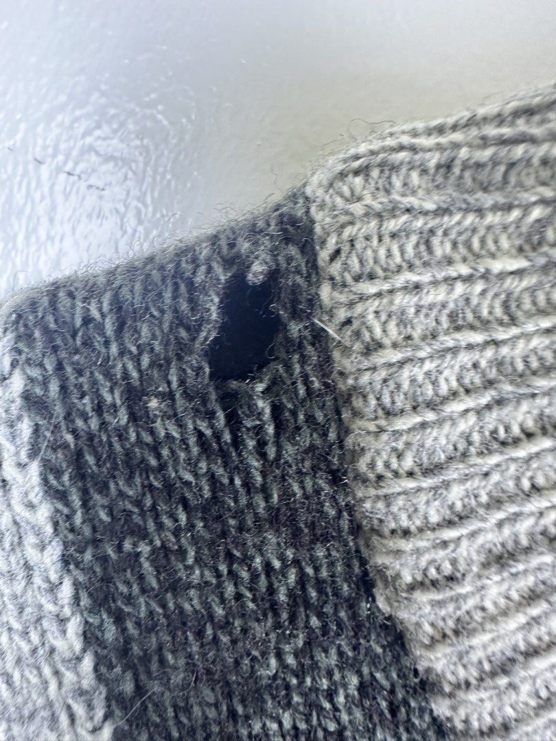 Burberrys Wool & Cashmere Checkerboard Sweater (Category: Longsleeves) located in Manila. Submitted by declutterpromax (Listing ID 1468969339, Image 2). Description: - Brand: Vintage Burberrys - Material: Luxurious wool and cashmere blend - Design: Cool grey & black patchwork checkerboard with front cable-knit texture - Details: Ribbed crewneck, cuffs, and hem - Condition: Flawed - includes a small hole near the collar and faint yellowish stainin