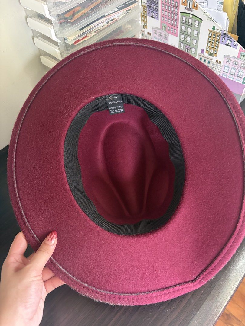 Burgundy Fedora Hat Stack from Sinners (Category: Caps & Hats) located in Las Pinas. Submitted by meep_morp_z (Listing ID 1468971581, Image 3). Description: - Color: Burgundy with a stylish black ribbon band - Size: 57 cm - Material: 100% polyester, structured brim, and pinched crown - Condition: Clean interior lining with original size tag attached.