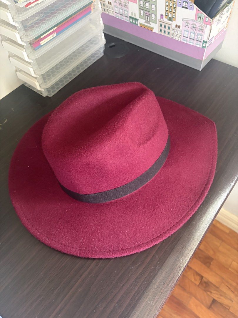 Burgundy Fedora Hat Stack from Sinners (Category: Caps & Hats) located in Las Pinas. Submitted by meep_morp_z (Listing ID 1468971581, Image 2). Description: - Color: Burgundy with a stylish black ribbon band - Size: 57 cm - Material: 100% polyester, structured brim, and pinched crown - Condition: Clean interior lining with original size tag attached.