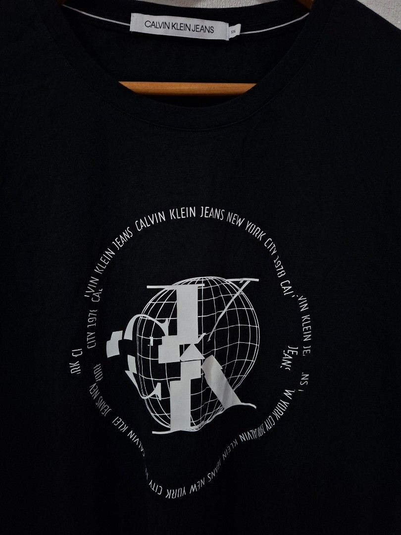 Calvin Klein globe logo shirts (Category: Tshirts & Polo Shirts ) located in Cavite. Submitted by labbudds20 (Listing ID 1469094855, Image 3). Description: Calvin Klein globe logo design size 2xl armpit to armpit 24 inches length 30 inches excellent to new condition see pictures for details.