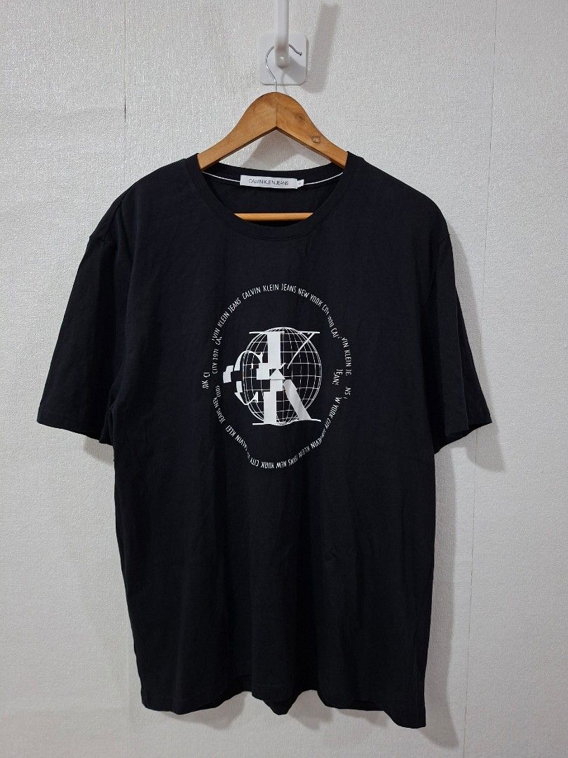 Calvin Klein globe logo shirts (Category: Tshirts & Polo Shirts ) located in Cavite. Submitted by labbudds20 (Listing ID 1469094855, Image 2). Description: Calvin Klein globe logo design size 2xl armpit to armpit 24 inches length 30 inches excellent to new condition see pictures for details.