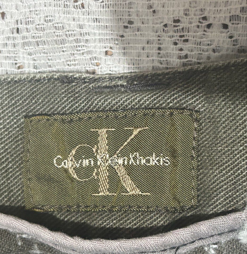 Calvin Klein Khakis Olive Green Cargo Pants 34 (Category: Jeans) located in Plaridel. Submitted by ilovebubu28 (Listing ID 1468949314, Image 3). Description: - Brand: Calvin Klein - Color: Olive Green - Style: Utility khakis / Straight leg casual trousers - Details: Front patch pockets, branded metal button, interior woven brand label - Condition: Great everyday wear - Shipping: Ships fast from PH / Meetups available (subject to location).