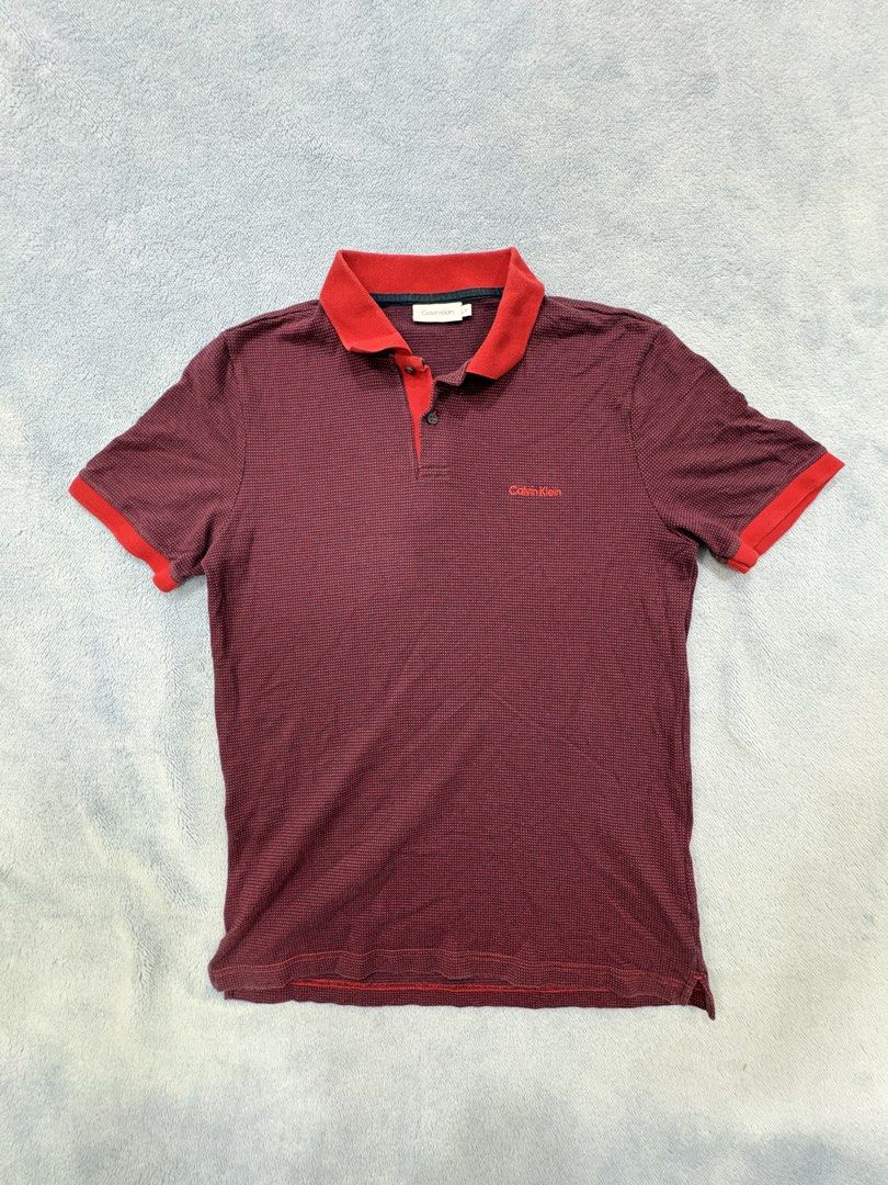 Calvin Klein Polo — Vintage Drip! (Category: Tshirts & Polo Shirts ) located in Alburquerque. Submitted by ukay_ni_edgar (Listing ID 1469019862, Image 1). Description: Burgundy tones, bold red accents, and clean CK style. 🔥.
