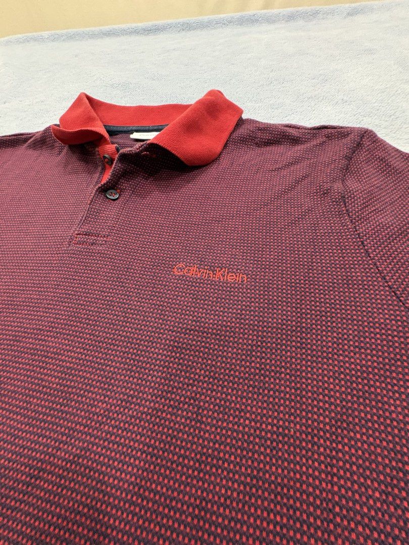 Calvin Klein Polo — Vintage Drip! (Category: Tshirts & Polo Shirts ) located in Alburquerque. Submitted by ukay_ni_edgar (Listing ID 1469019862, Image 2). Description: Burgundy tones, bold red accents, and clean CK style. 🔥.