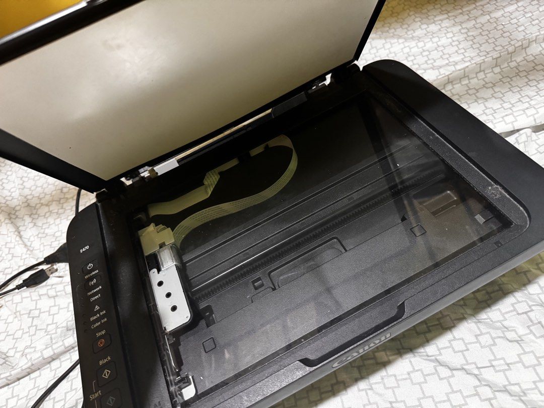 Canon PIXMA E470 All-In-One Wireless Printer (Category: Printers, Scanners & Copiers) located in Manila. Submitted by ivoryscloset (Listing ID 1468953945, Image 2). Description: - Model: Canon PIXMA E470 Multifunction Printer (Black) - Features: Print, copy, and scan with the built-in flatbed scanner - Connectivity: Wireless setup capabilities for easy printing - Design: Compact footprint, perfect for small home office desks - Controls: User-frie