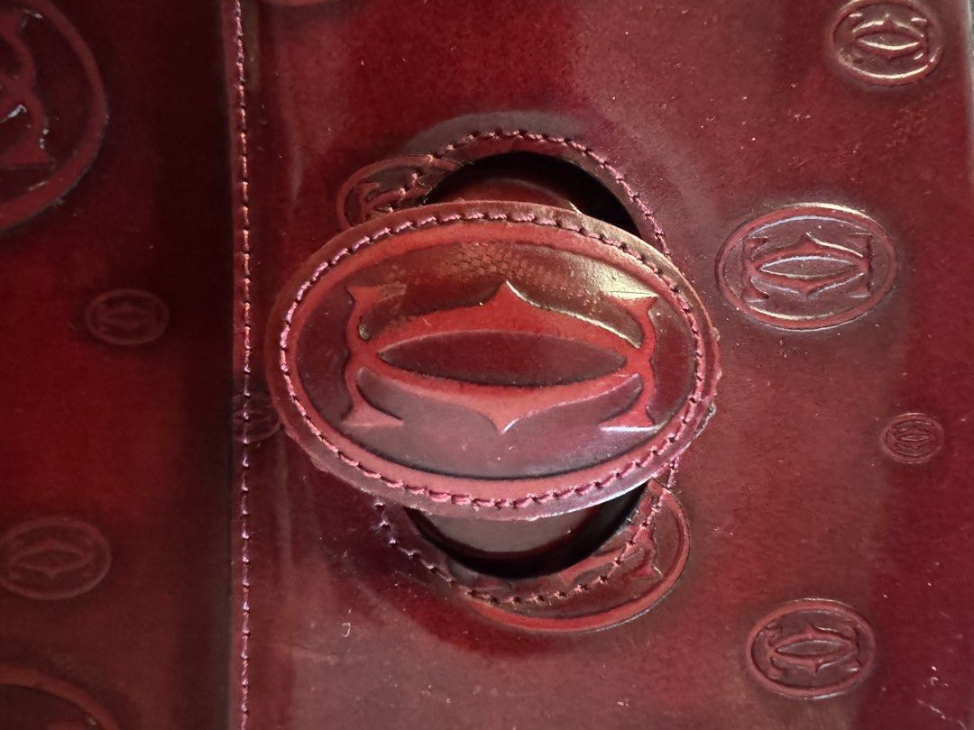 Cartier Happy Birthday Backpack (Category: Backpacks) located in Caloocan City. Submitted by gabbieerfritter (Listing ID 1469031573, Image 3). Description: - Brand: Cartier - Material: Premium Leather - Color: Deep Bordeaux Red - Pattern: Embossed All-Over Double C Monogram - Closure: Flap with Buckle Detail & Dual Zipper Main Compartment - Hardware: YBS Hardware - Interior: Signature Branded Lining Issue: visible scratches .