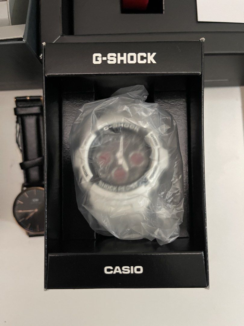 Casio G-Shock Men’s Watch in Original Box (Category: Men's Watches) located in Quezon City. Submitted by bravehorse_f1f6d5 (Listing ID 1469123680, Image 1). Description: - Brand: Casio G-Shock - Color: White design with black face and striking red sub-dials - Condition: Brand new, never used, straight out of the packaging - Packaging: Still inside the protective plastic wrapper and original black presentation box - Ideal for: Collectors, daily we