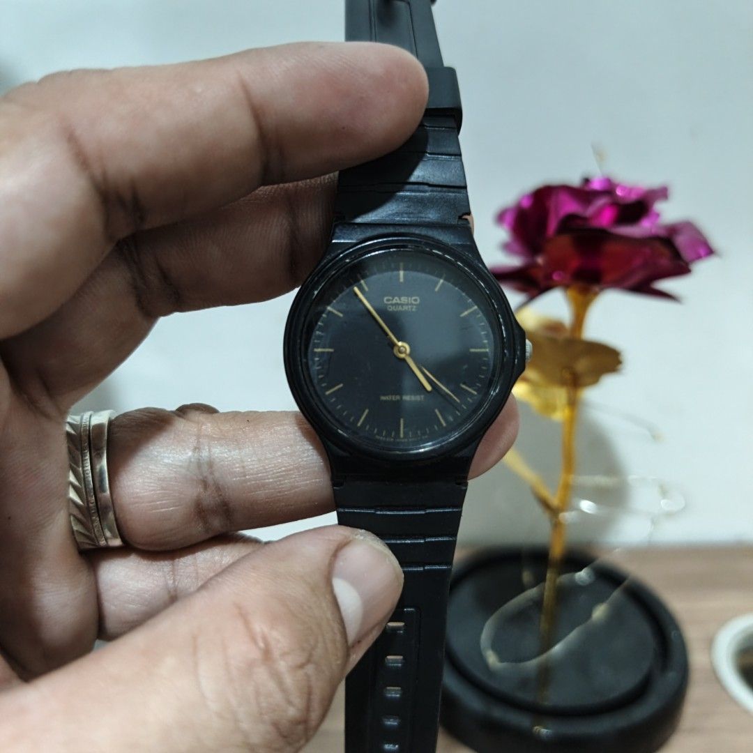 Casio Quartz Black Analog Watch MQ-24 (Category: Men's Watches) located in Manila. Submitted by narju1234 (Listing ID 1468999528, Image 1). Description: - Brand: Casio (Model MQ-24) - Movement: Quartz, battery-powered (runs well) - Design: All-black body with elegant gold hands and hour markers - Strap: Lightweight resin strap with secure buckle closure (no cracks) - Condition: Minor scuffs on the crystal face from normal wear - Features: Water-r