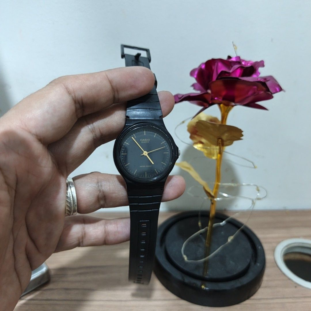 Casio Quartz Black Analog Watch MQ-24 (Category: Men's Watches) located in Manila. Submitted by narju1234 (Listing ID 1468999528, Image 2). Description: - Brand: Casio (Model MQ-24) - Movement: Quartz, battery-powered (runs well) - Design: All-black body with elegant gold hands and hour markers - Strap: Lightweight resin strap with secure buckle closure (no cracks) - Condition: Minor scuffs on the crystal face from normal wear - Features: Water-r