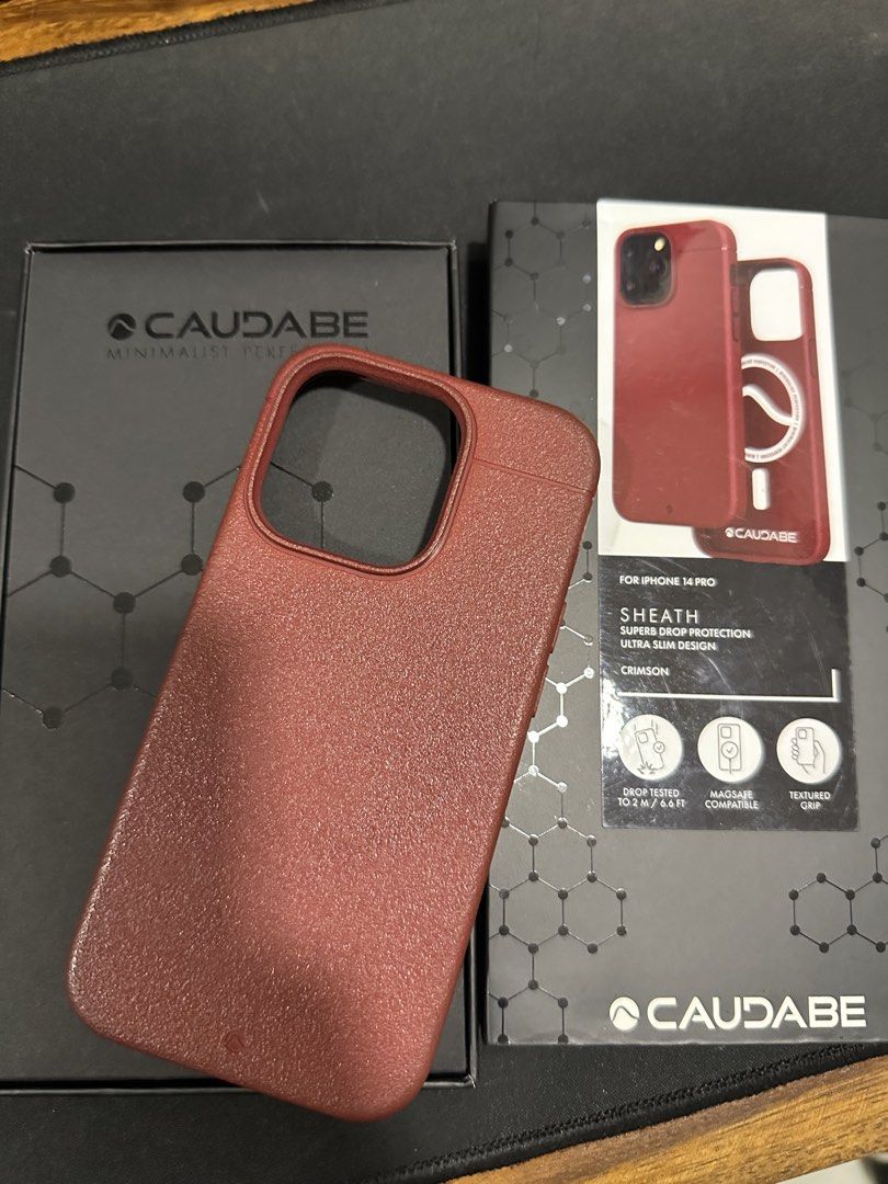 Caudabe iphone 14 pro case red (Category: Cases & Sleeves) located in Quezon City. Submitted by dlsy12 (Listing ID 1469010976, Image 1). Description: - Brand: Caudabe - Model: Sheath for iPhone 14 Pro - Color: Crimson Red - Features: MagSafe compatible, textured grip for anti-slip, ultra slim design - Protection: Drop tested up to 2m / 6.6 ft with ShockLite material - Condition: Well-maintained and ready to use.
