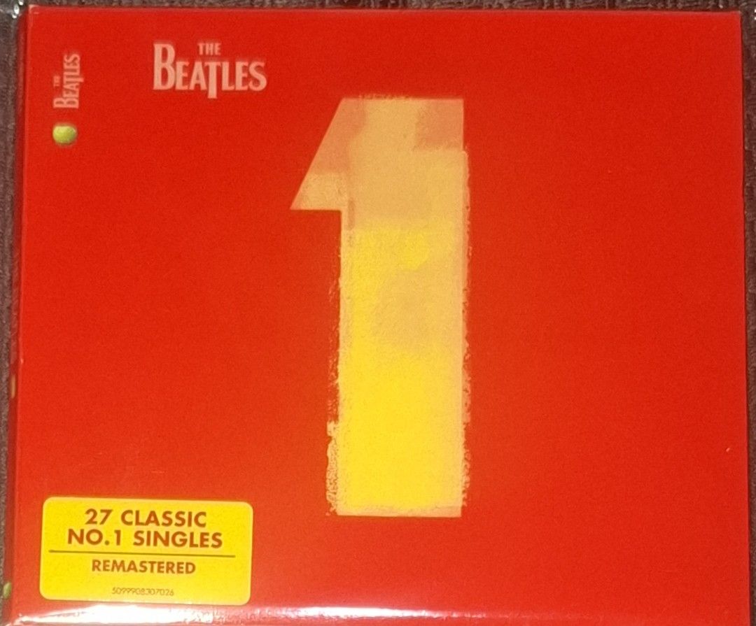 (CD) The Beatles: No. 1 (Remastered) (Category: CDs & DVDs) located in Makati City. Submitted by decluttermp (Listing ID 1469112482, Image 1). Description: - Remastered edition featuring 27 legendary number one hits - Includes classic tracks from Day Tripper to The Long and Winding Road - Iconic red case with the signature yellow number one graphic on the front - Back cover displays track numbers 12-27 and portraits of John, Paul, George, and Rin