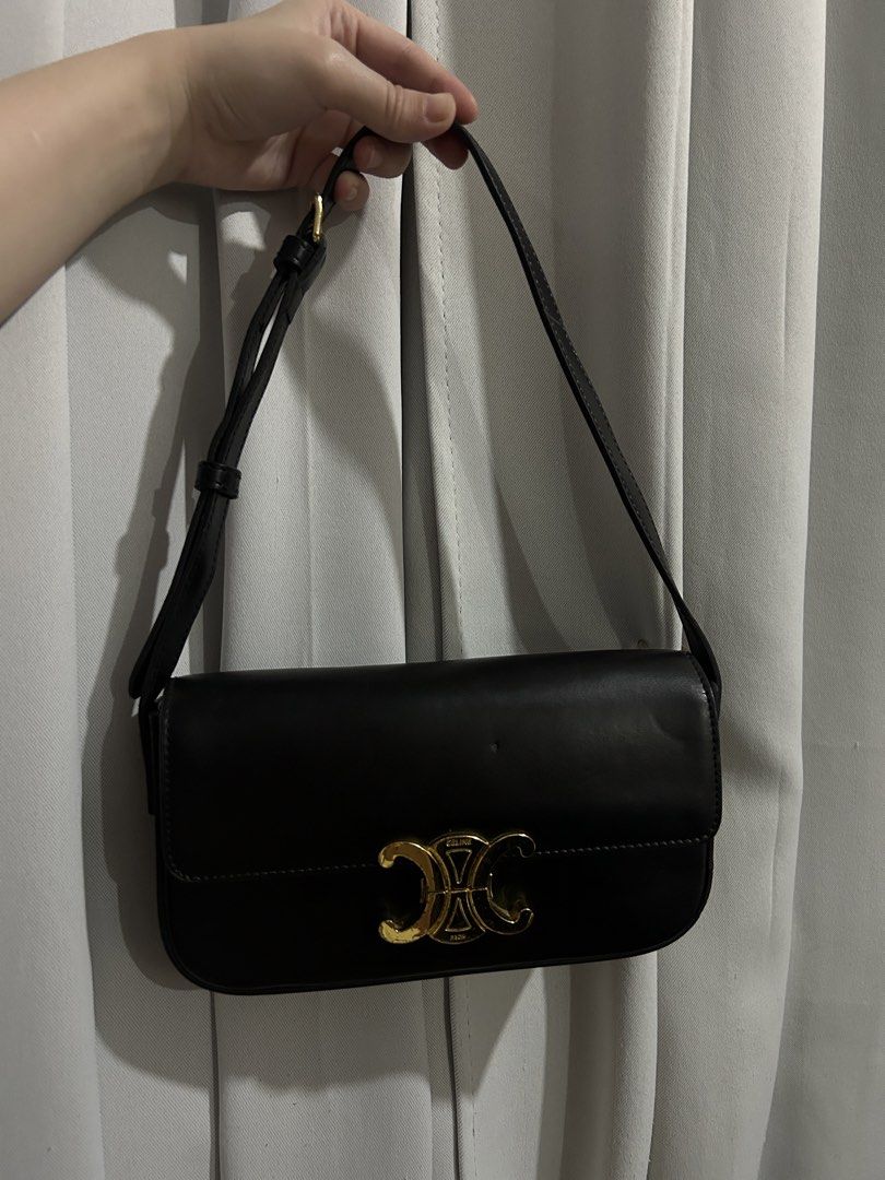 Celine Black Triomphe Shoulder Bag (Category: Luxury Bags & Wallets) located in Manila. Submitted by v2zw2tvccm81718 (Listing ID 1469072044, Image 2). Description: - Color: Timeless black with sleek gold hardware - Design: Iconic Triomphe clasp closure and clean lines - Material: Premium smooth leather body - Strap: Adjustable with a chic buckle detail - Branding: Subtle gold branding on the metal closure - Style: Versatile everyday silhouette th