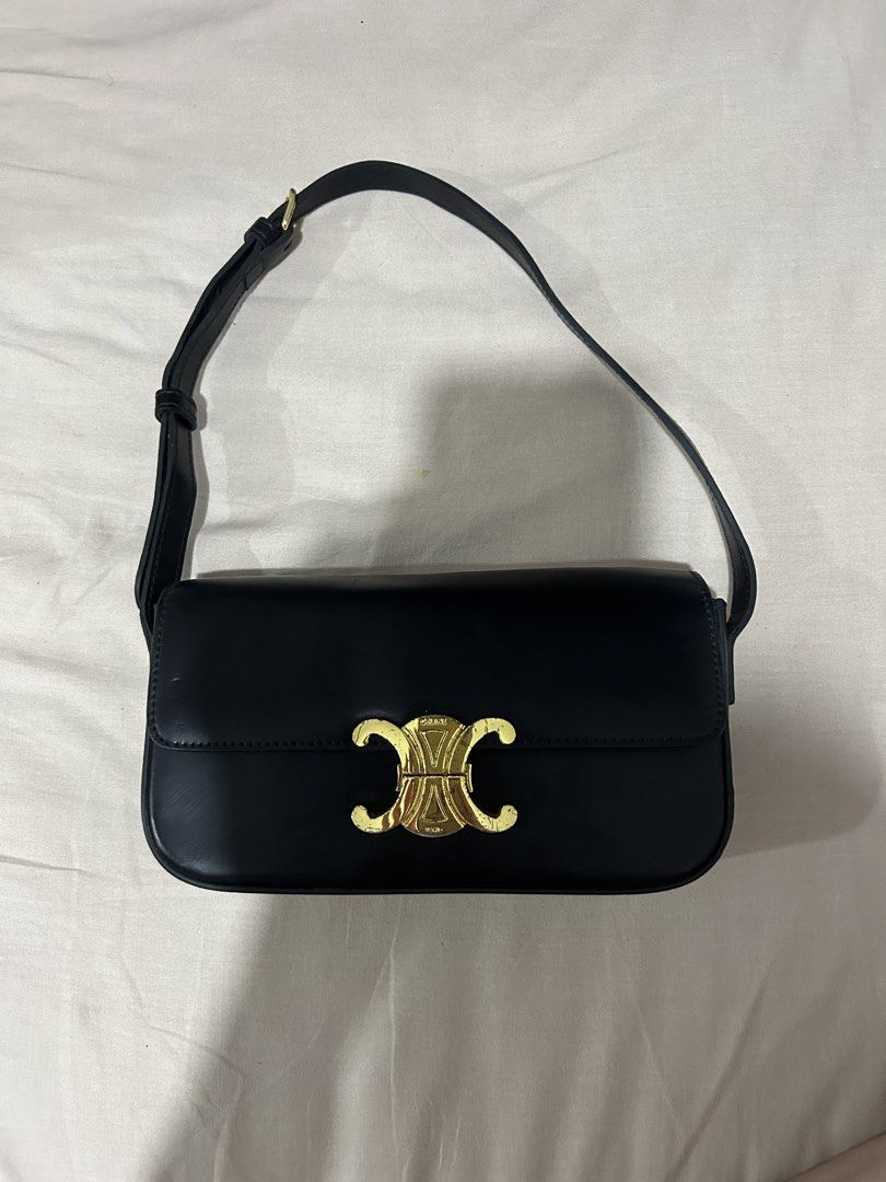 Celine Black Triomphe Shoulder Bag (Category: Luxury Bags & Wallets) located in Manila. Submitted by v2zw2tvccm81718 (Listing ID 1469072044, Image 1). Description: - Color: Timeless black with sleek gold hardware - Design: Iconic Triomphe clasp closure and clean lines - Material: Premium smooth leather body - Strap: Adjustable with a chic buckle detail - Branding: Subtle gold branding on the metal closure - Style: Versatile everyday silhouette th