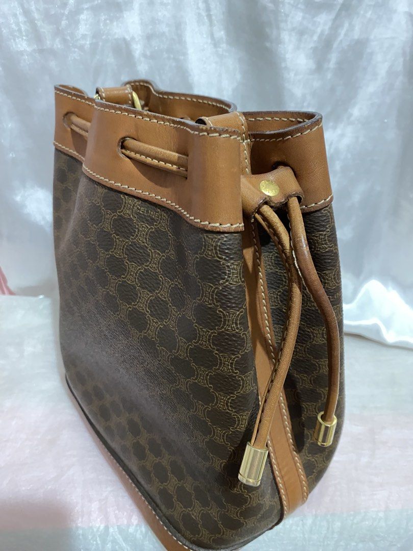 Celine Macadam Brown Bucket Bag (Category: Luxury Bags & Wallets) located in Taguig. Submitted by nekosan_ (Listing ID 1468990900, Image 3). Description: Original may pouch/wallet May minor flaws rubs Small size.