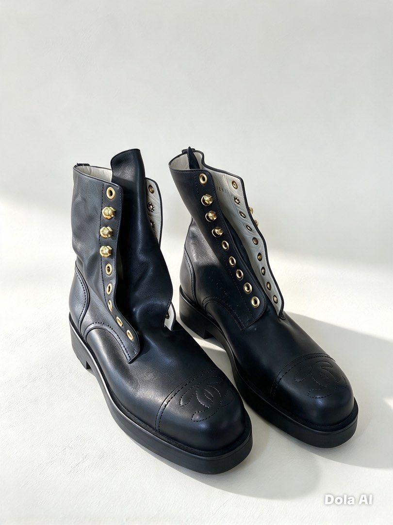 Chanel Black Leather CC Cap-Toe Combat Boots (Category: Boots) located in Aroroy. Submitted by mahinaanlangs (Listing ID 1468953049, Image 2). Description: - Authentic Chanel black smooth leather combat boots - Features iconic stitched CC logo quilting on the cap toes - Elegant gold-tone eyelet hardware details - Durable chunky lug soles with stamped Chanel double-C logo - Ankle-height lace-up style with thick rubber tread Size 35 1/2 Excellent C