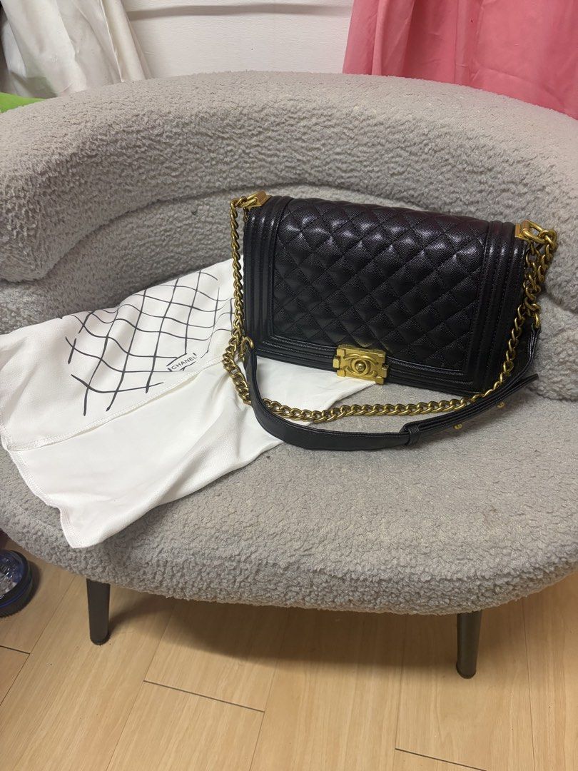 Chanel Boy Bag Black Caviar Gold Hardware (Category: Luxury Bags & Wallets) located in Manila. Submitted by axchichaaa (Listing ID 1468998633, Image 1). Description: - Brand: Chanel Boy Bag - Material: Black quilted caviar leather - Hardware: Antiqued gold-tone chain strap and CC push-lock clasp - Interior: Burgundy fabric lining with a convenient zippered pocket - Shape: Structured rectangular design with thick borders - Inclusion: Comes with a 