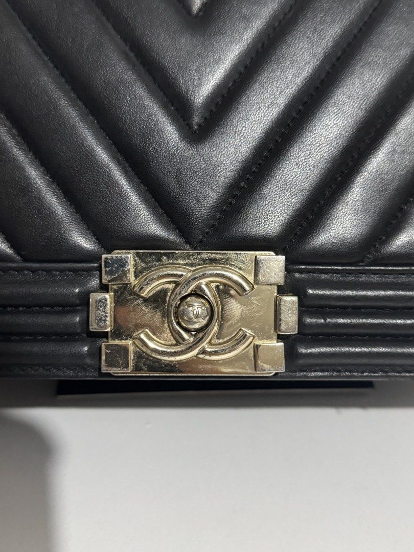 Chanel Chevron Boy Flap Bag Black (Category: Luxury Bags & Wallets) located in Manila. Submitted by reinjoseph (Listing ID 1469000811, Image 2). Description: - Brand: Chanel Boy Bag - Material: Black quilted chevron leather - Hardware: Silver tone with iconic CC push-lock closure - Strap: Chunky chain with leather shoulder pad and engraved metal links - Structure: Structured rectangular shape with reinforced borders - Style: Classic daily luxury 
