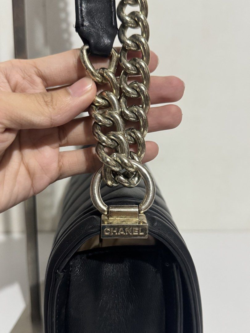 Chanel Chevron Boy Flap Bag Black (Category: Luxury Bags & Wallets) located in Manila. Submitted by reinjoseph (Listing ID 1469000811, Image 3). Description: - Brand: Chanel Boy Bag - Material: Black quilted chevron leather - Hardware: Silver tone with iconic CC push-lock closure - Strap: Chunky chain with leather shoulder pad and engraved metal links - Structure: Structured rectangular shape with reinforced borders - Style: Classic daily luxury 