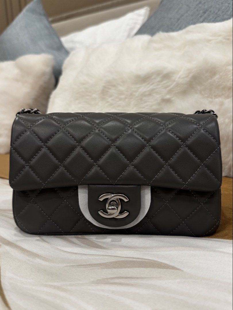 Chanel Crush (Category: Luxury Bags & Wallets) located in Manila. Submitted by love_preloveddd (Listing ID 1469045346, Image 1). Description: - Chanel flap bag in dark grey quilted leather - Stunning silver-tone hardware with interlocking CC turn-lock closure - Features classic interwoven chain and leather strap - Structured silhouette with immaculate stitching throughout - Perfect luxury investment piece for any wardrobe.