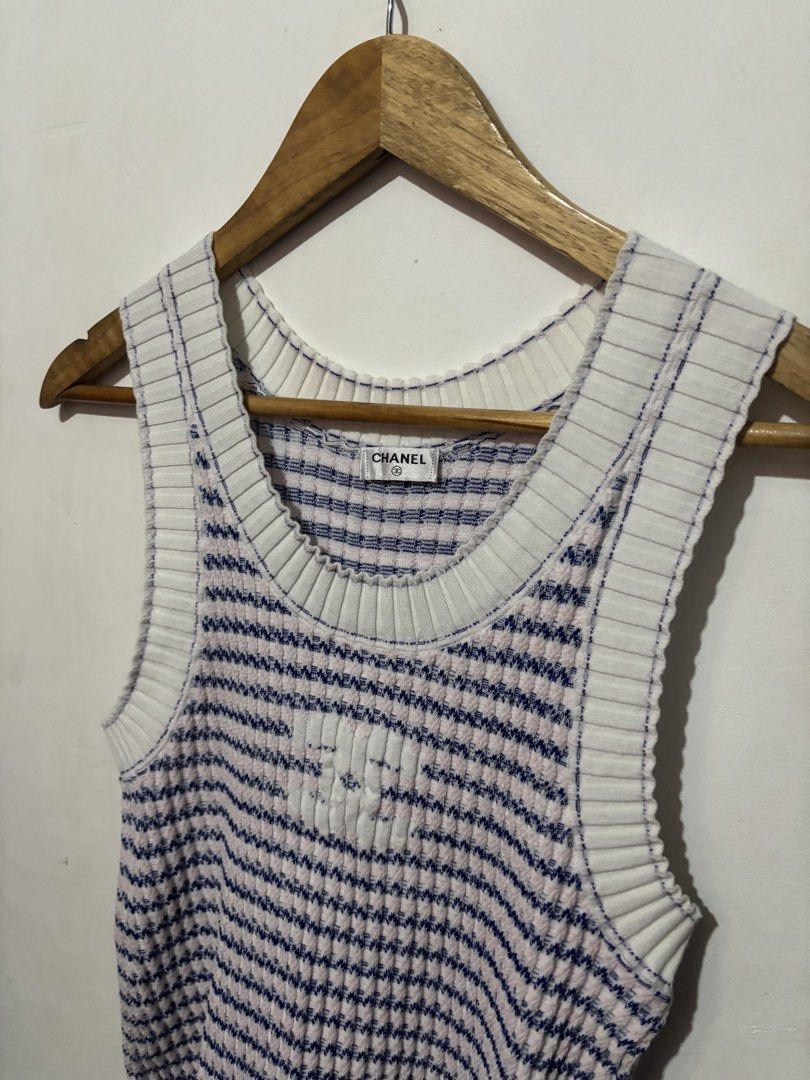 Chanel Knit Tank Top (Category: Sleeveless) located in Subic. Submitted by thriftpoison (Listing ID 1468973046, Image 2). Description: Chanel knit tank top in white, blue, and pink stripes. Subtle debossed CC logo right on the front chest. Ribbed trim around the scoop neckline and armholes. Made in Italy from an 80 percent cotton and 20 percent polypropylene blend. Size 38 tag attached inside. Classic luxury piece for warmer weather..
