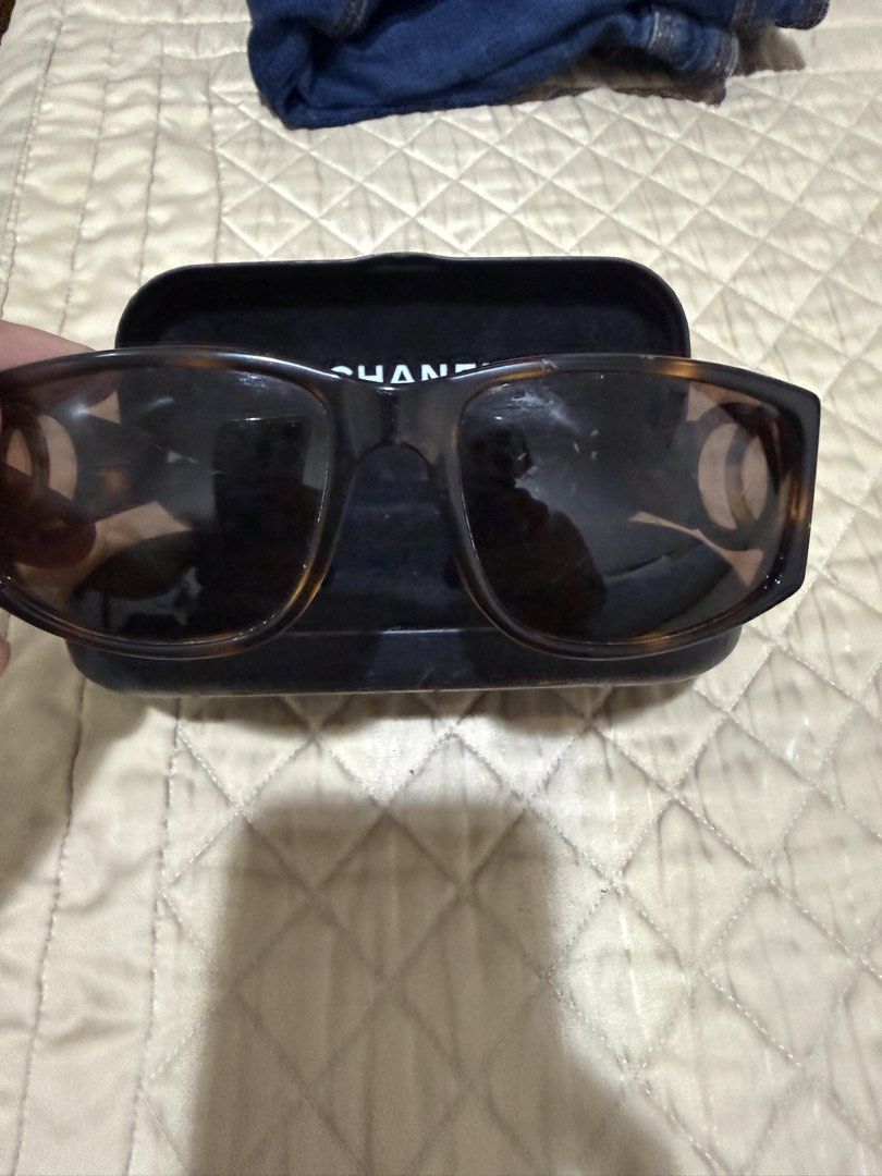 Chanel Tortoiseshell Sunglasses with CC Logo (Category: Sunglasses & Eyewear) located in Quezon City. Submitted by aaathrifts (Listing ID 1468969227, Image 2). Description: - Brand: Chanel - Style: Classic square tortoiseshell frames with brown tinted lenses - Details: Large silver CC logo hardware on temples - Condition: Clean lenses, sturdy hinges, great everyday luxury piece - Inclusions: Comes with original Chanel hard case -fit for small fra
