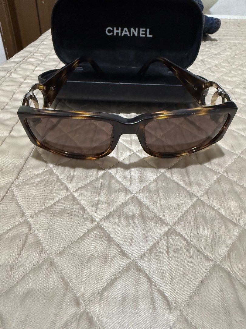 Chanel Tortoiseshell Sunglasses with CC Logo (Category: Sunglasses & Eyewear) located in Quezon City. Submitted by aaathrifts (Listing ID 1468969227, Image 1). Description: - Brand: Chanel - Style: Classic square tortoiseshell frames with brown tinted lenses - Details: Large silver CC logo hardware on temples - Condition: Clean lenses, sturdy hinges, great everyday luxury piece - Inclusions: Comes with original Chanel hard case -fit for small fra