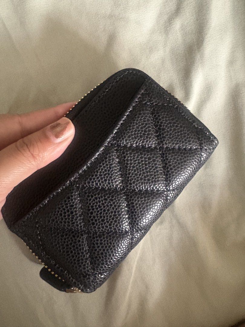 Chanel Wallet (Category: Wallets & Card holders) located in Manila. Submitted by mndoxajc (Listing ID 1469158489, Image 2). Description: - Authentic Chanel zip coin purse - Luxurious black quilted caviar leather - Elegant gold-tone hardware with iconic interlocking CC logo - Burgundy fabric-lined interior with multiple compartments - Compact size, fits easily into mini bags or pockets - Includes authenticity card.
