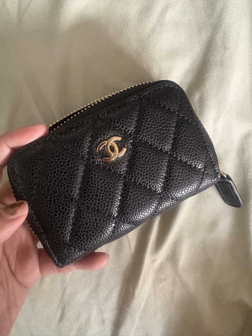 Chanel Wallet (Category: Wallets & Card holders) located in Manila. Submitted by mndoxajc (Listing ID 1469158489, Image 1). Description: - Authentic Chanel zip coin purse - Luxurious black quilted caviar leather - Elegant gold-tone hardware with iconic interlocking CC logo - Burgundy fabric-lined interior with multiple compartments - Compact size, fits easily into mini bags or pockets - Includes authenticity card.