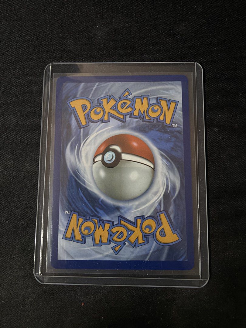 Charizard (Category: Raw Cards) located in Singapore. Submitted by jrrrrrrrr (Listing ID 1469108021, Image 2). Description: - Card: Charizard Holo (4/102) - Pokemon Celebrations Set - Features: Classic base set artwork with special 30th-anniversary stamp - Condition: Pristine surface, sharp corners, and vibrant foil - Protection: Stored safely in a top loader since day one - Deal: Fast shipping or convenient meetup available in Singapore.